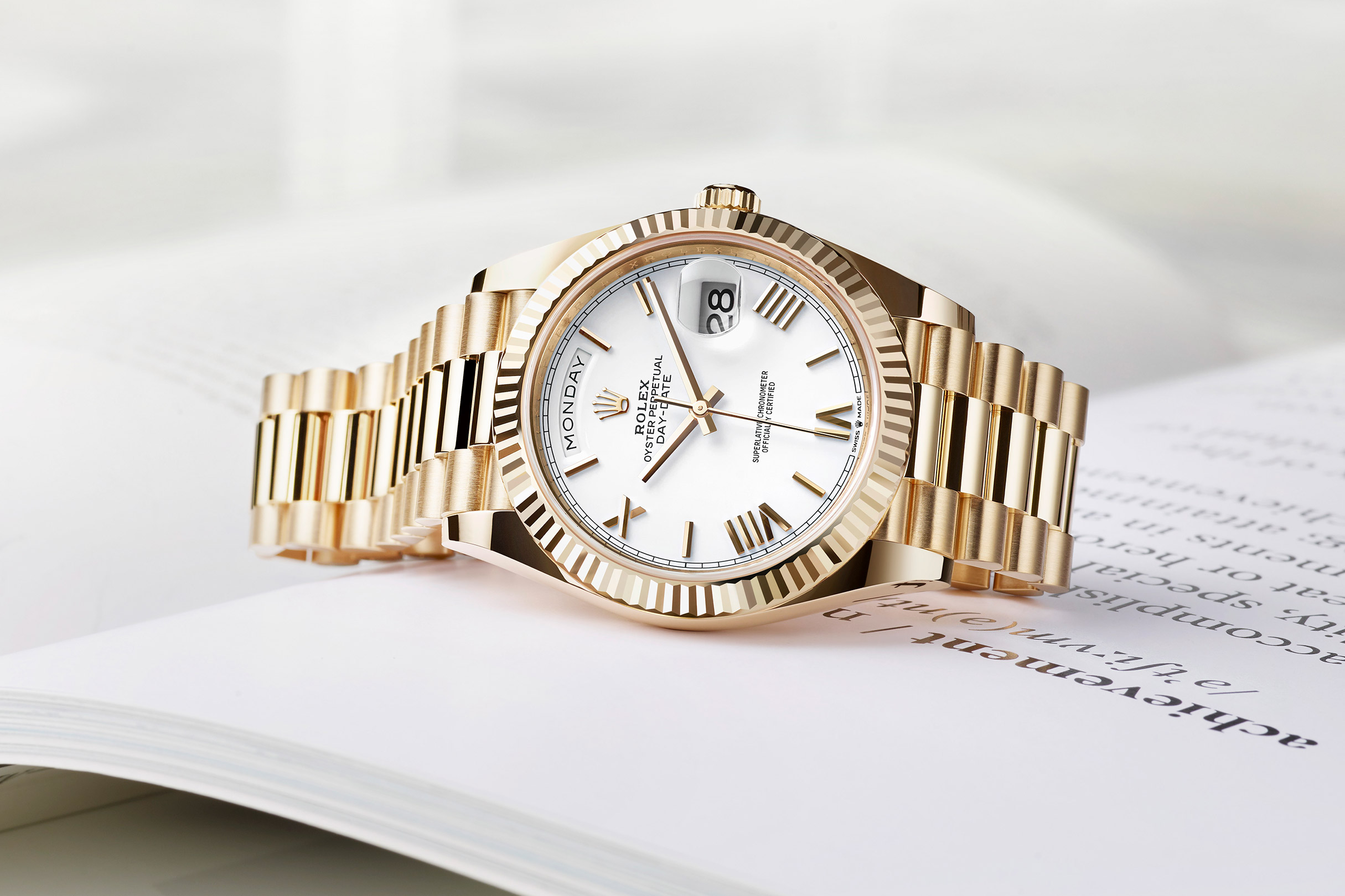 gold rolex day date white face